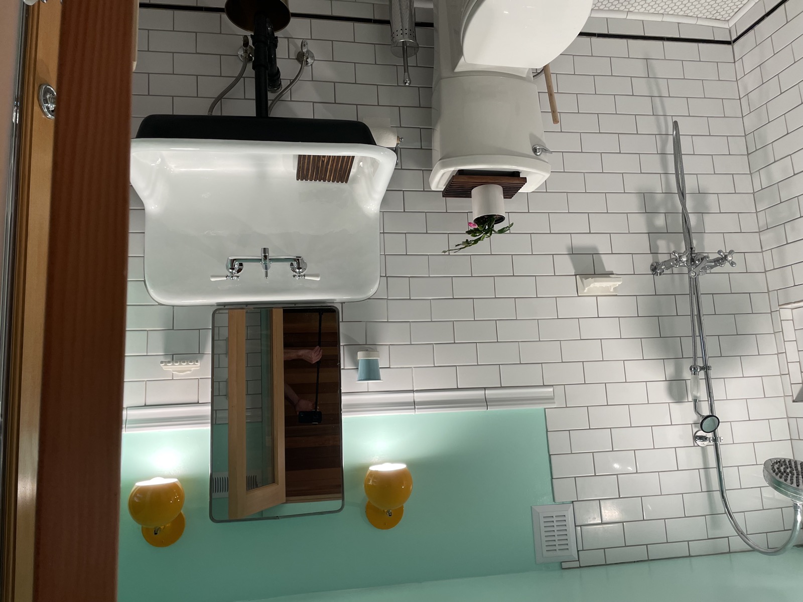 Bathroom with clawfoot sink, subway tile, and teal floor