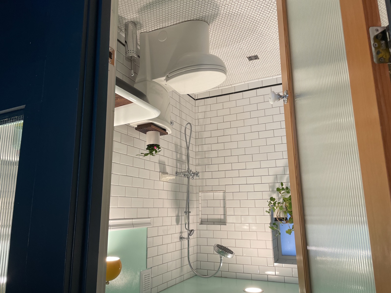 View looking into the tiled bathroom from the living area