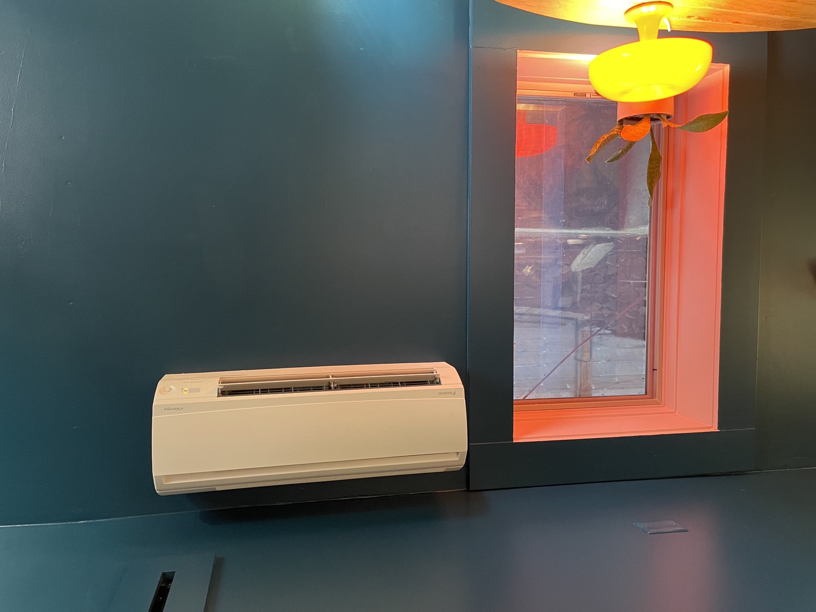 Mini-split heating and cooling unit on the wall