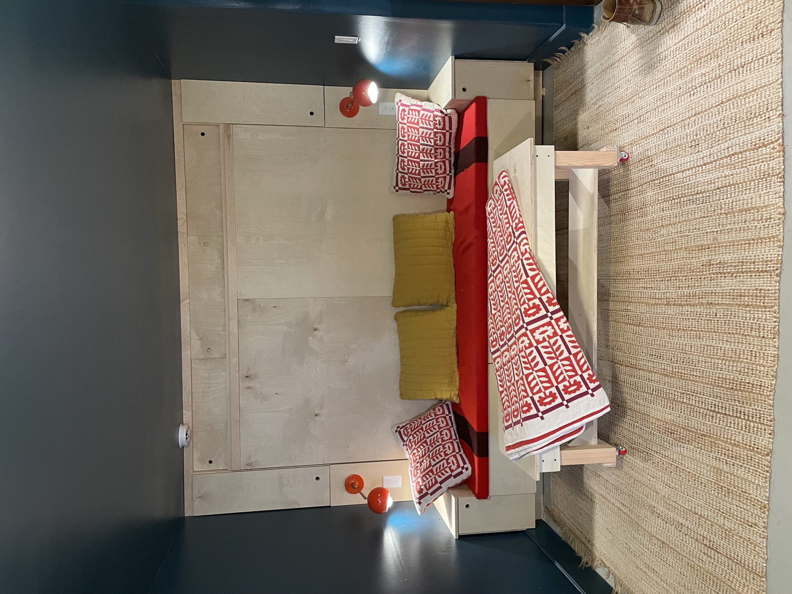Murphy bed folded up into the wall revealing open floor space