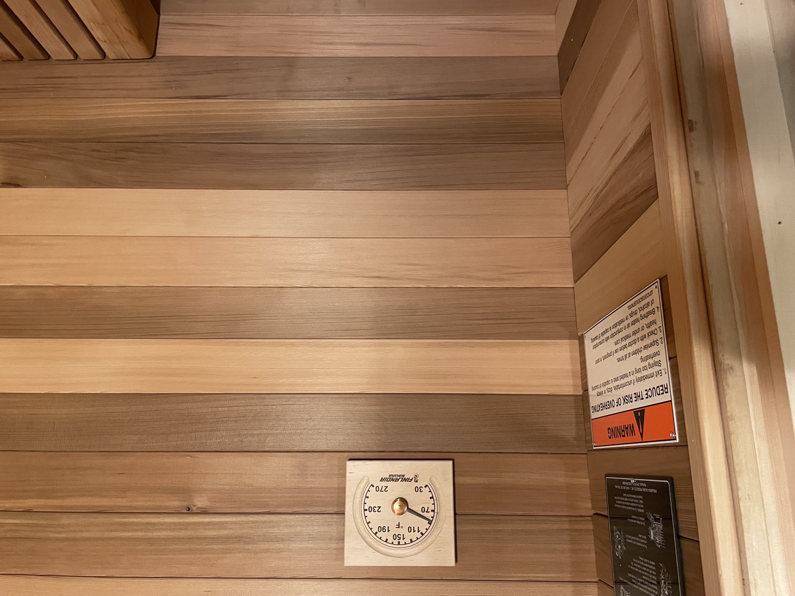 Finnish sauna cedar walls and thermometer