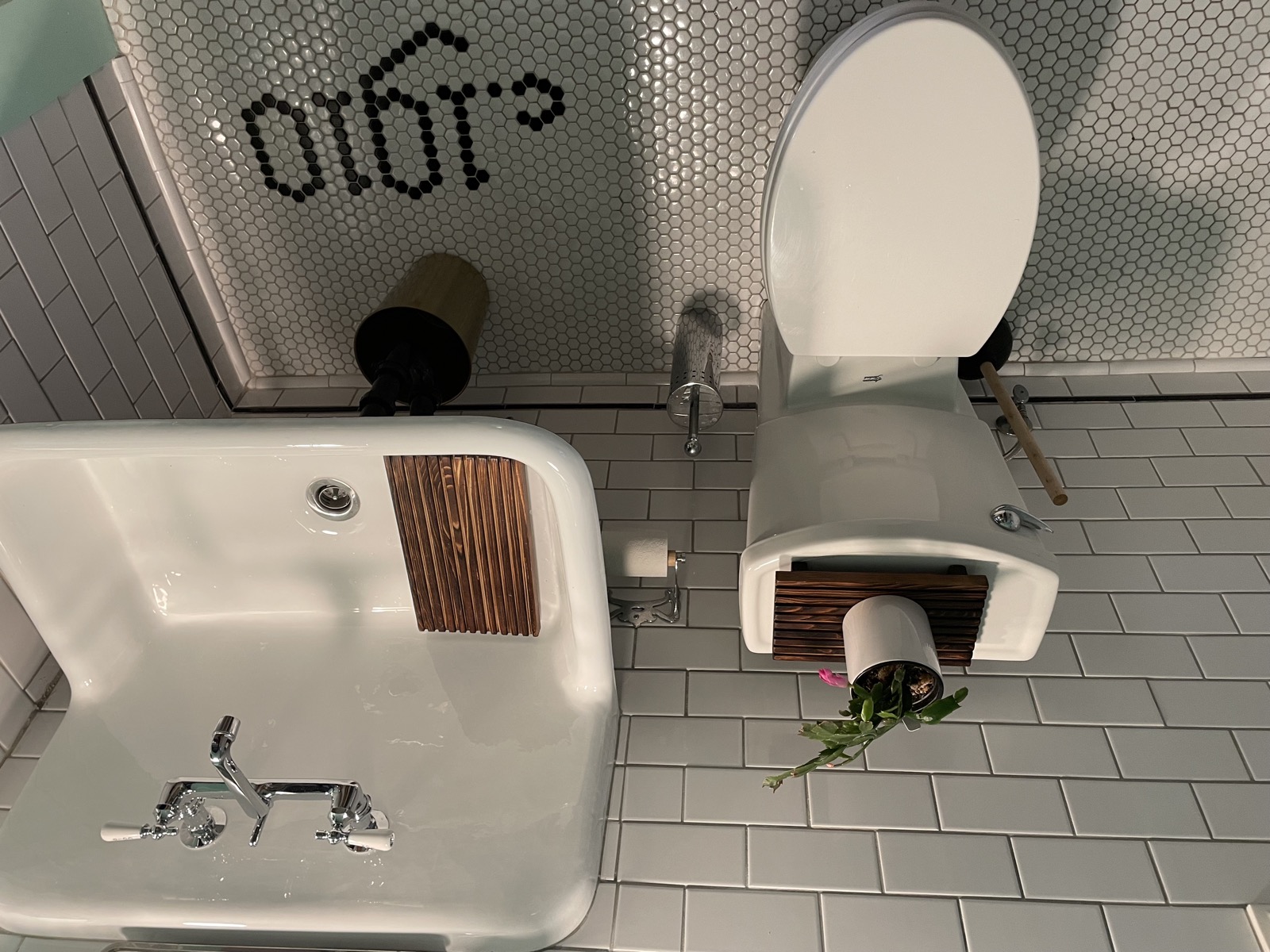 Bathroom tilework detail with vintage sink and hexagonal tile ceiling